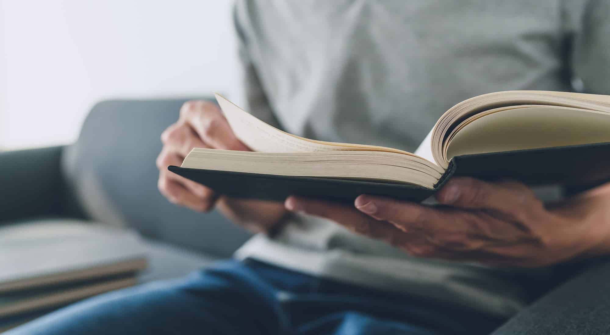 man reading book