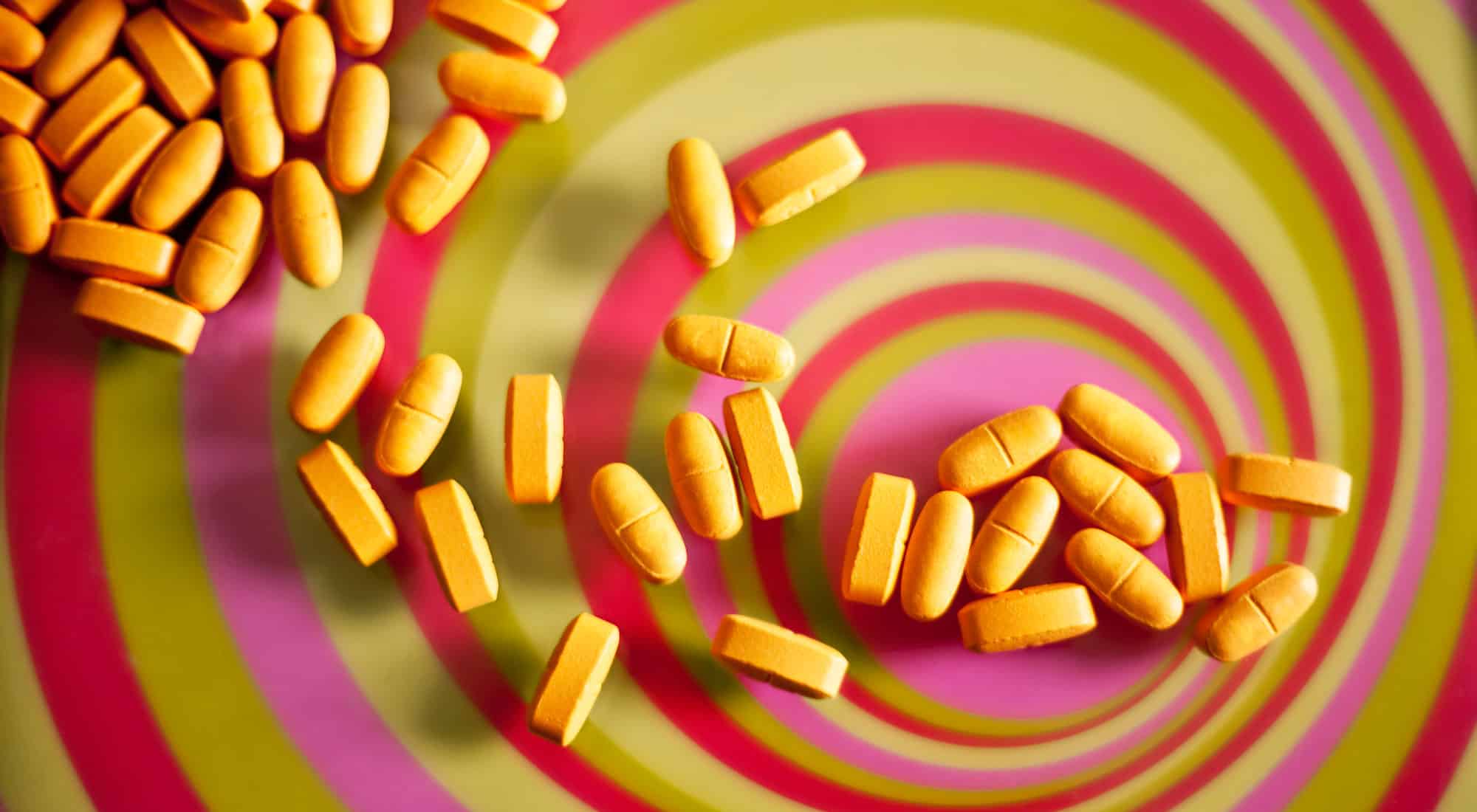 Pills on top of psychedelic swirls