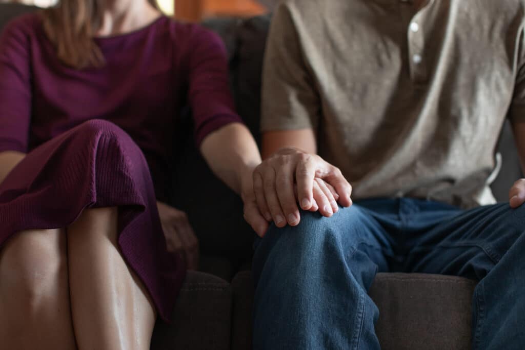 Couple is having a marriage counseling to repair their relationship after sex addiction