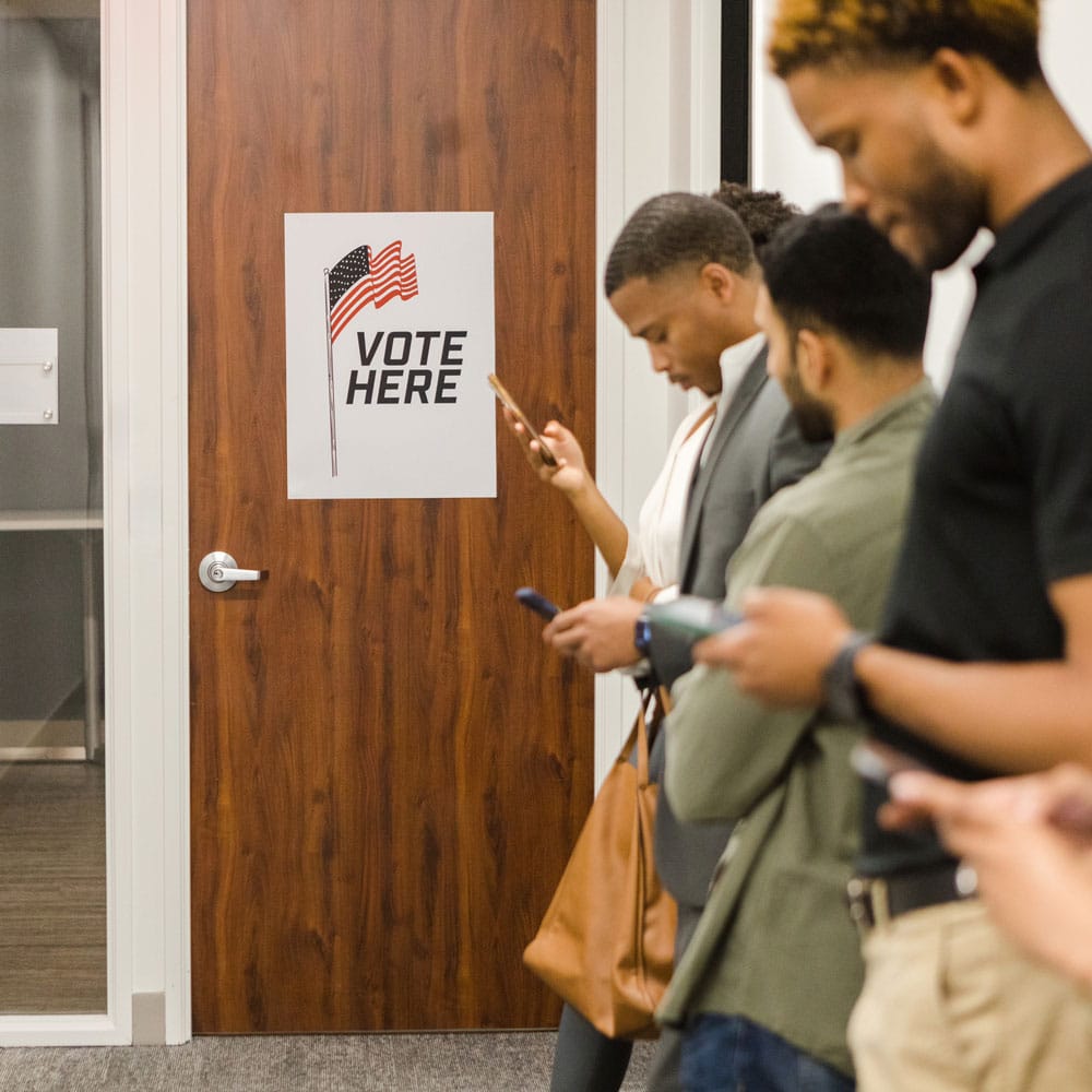 people waiting in line to vote