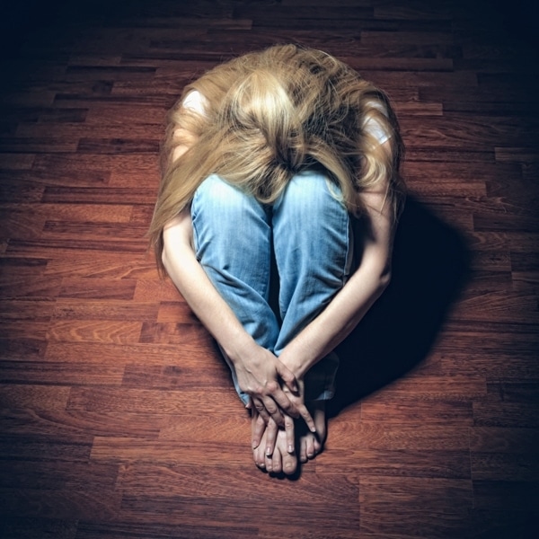 A girl sitting on the ground