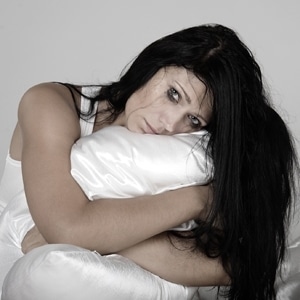 Woman with pillow, self harm and eating disorders