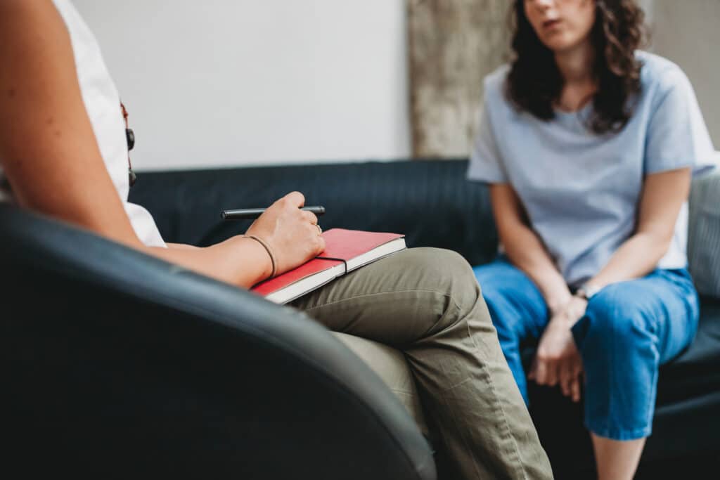 CBT session, woman talking to her psychologist to heal emotional dysregulation